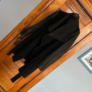 Vera wang coat.  Great leather like sleeves with a wrap waist. Very flattering!